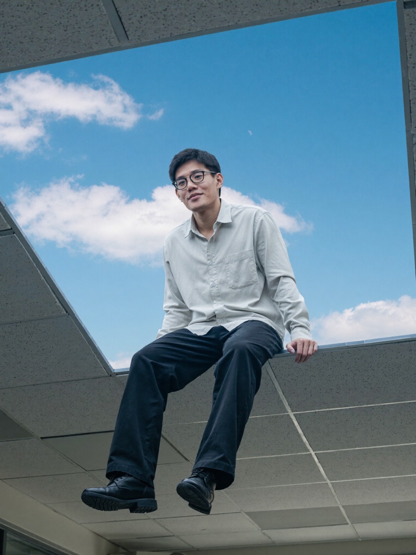 Portrait of Felix Lee against an open sky